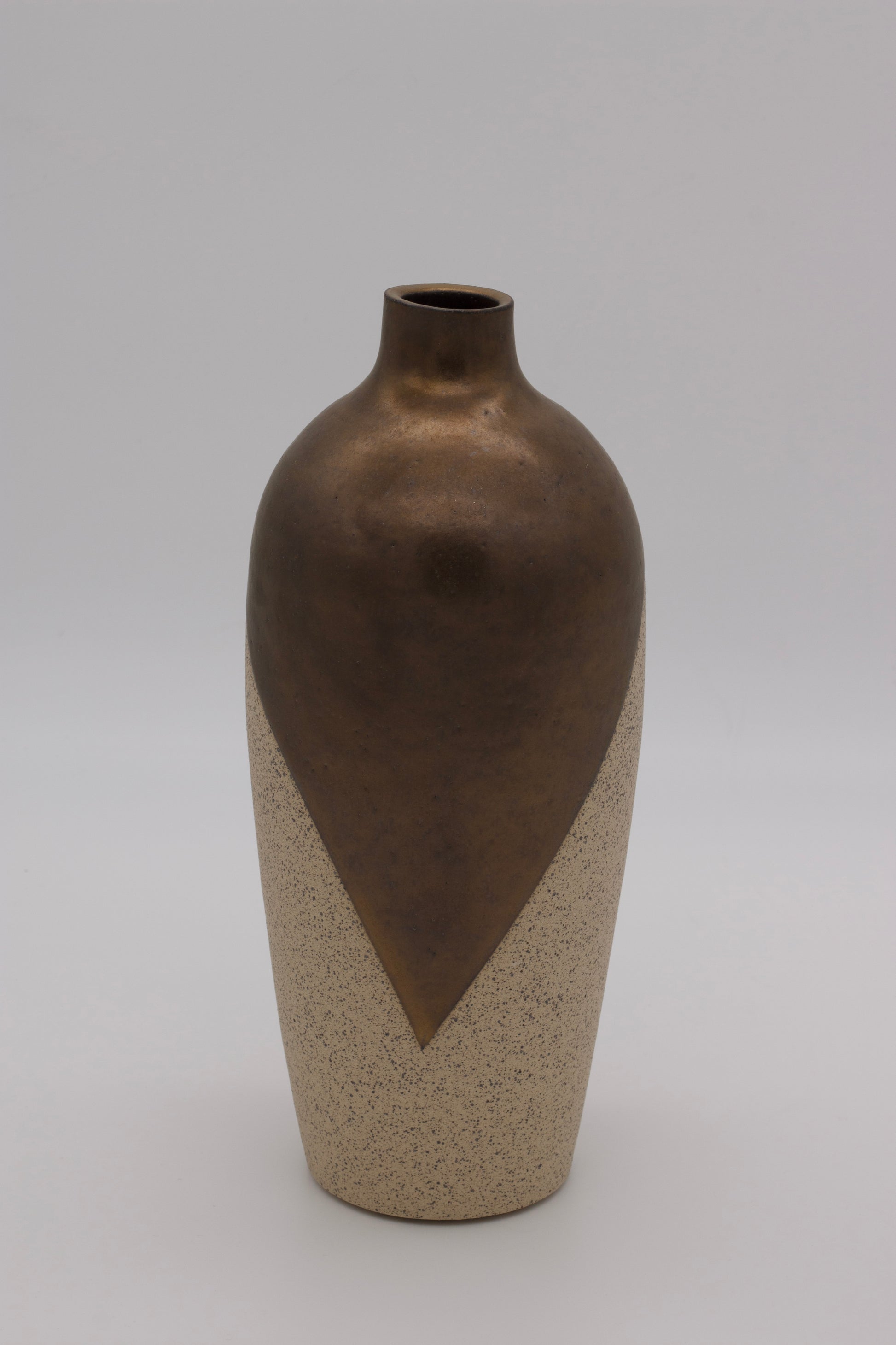 Vase with two-tone design on a plain background